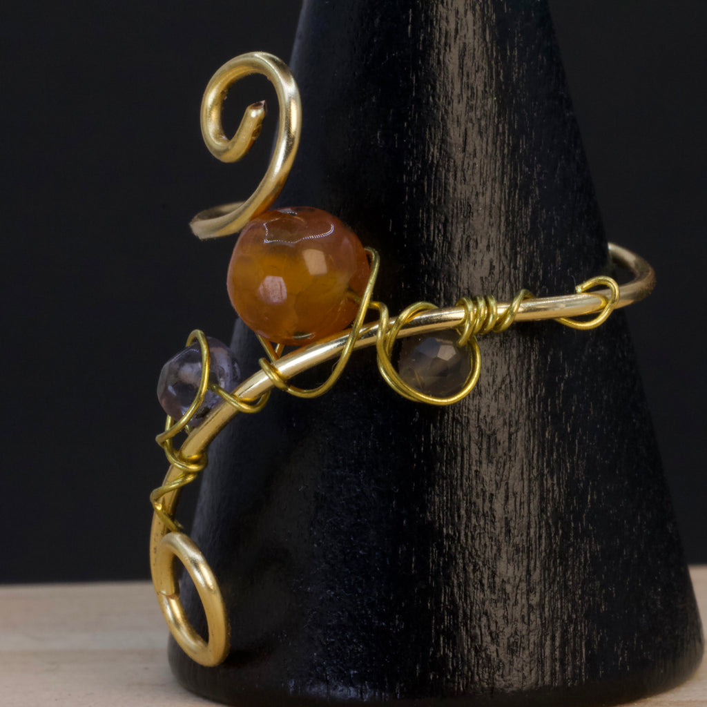 Anello in tanzanite, corniola e adularia | spirale dorata