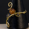 Anello in tanzanite, corniola e adularia | spirale dorata