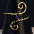 Anello in ametista | spirale dorata essenziale